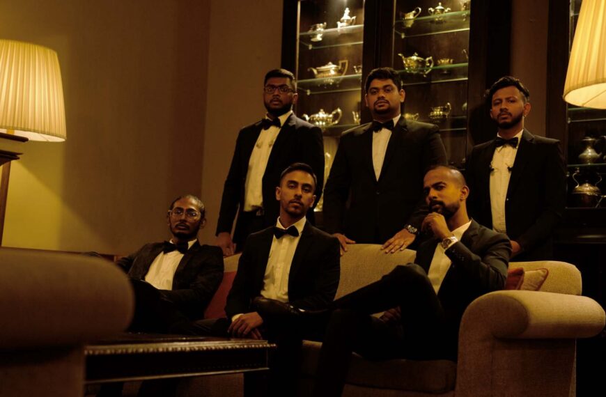 Watalappan band in moody, dark setting with yellow glow; Mangala Yojana matrimony, SL marriage proposals 2024.