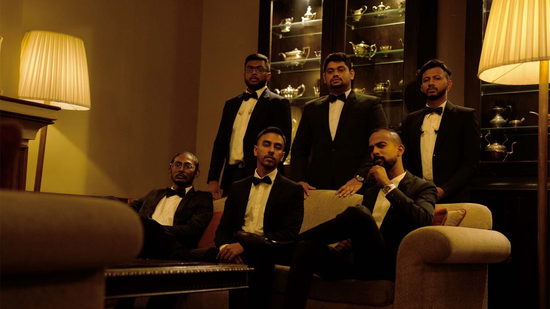 Watalappan band in moody, dark setting with yellow glow; Mangala Yojana matrimony, SL marriage proposals 2024.