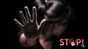 A woman raises her hand with "stop" written on her palm, symbolizing resistance and awareness in preventing violence against women, highlighting safety in Sri Lankan matrimony, Mangala Yojana, and marriage proposals in Sri Lanka through trusted wedding proposal websites like Poruwa.lk | ශ්‍රී ලාංකීය මංගල යෝජනා.