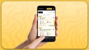 A hand grips a smartphone on a yellow background, highlighting the app's design and functionality, showcasing features for SriLanka matrimony and matrimony Sri Lanka, helping users explore marriage proposals Sri Lanka, and plan for a traditional Poruwa ceremony.