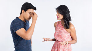A man and woman engaged in conversation, facing each other with attentive expressions during a Sri Lanka matrimony discussion.