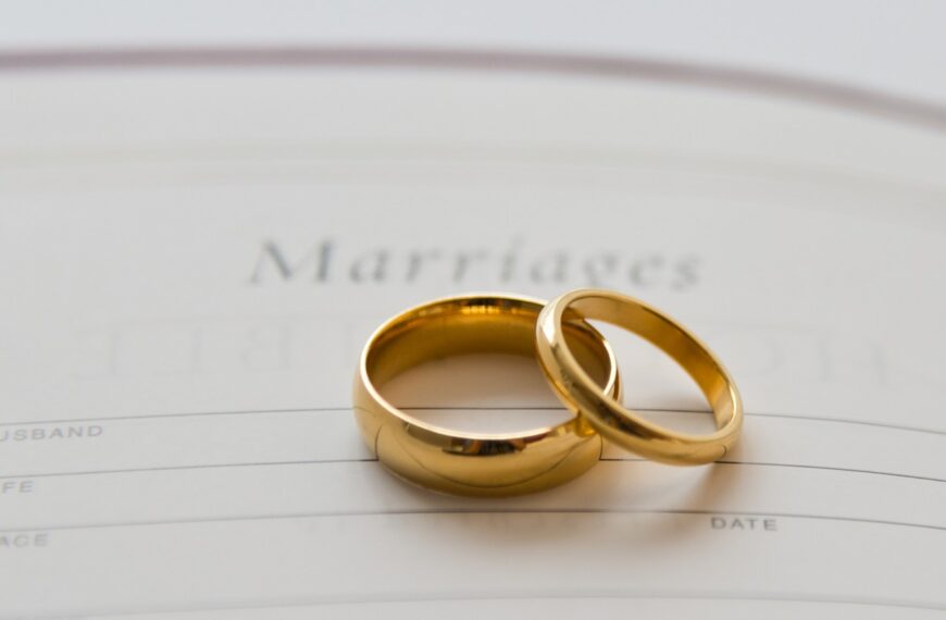 Two gold wedding rings resting on a marriage certificate, symbolizing union while exploring mangala yojana traditions, marriage proposals in Sri Lanka, matrimony Sri Lanka services, Poruwa.lk | ශ්‍රීලංකීය මංගල යෝජනා, Poruwa ceremony planning, Liyathabara marriage proposals, LankaMatrimony, Catholic marriage proposals, Hitad marriage proposals, Purahanda LK, Buddhist matrimony, and connections for Lanka brides and grooms.