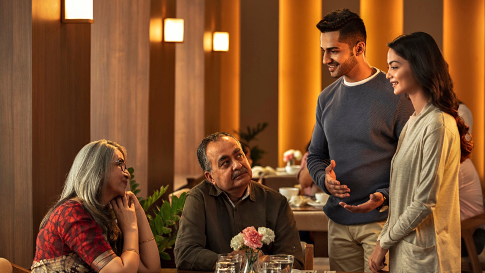 A man and woman engage in conversation with another couple at a restaurant table, reflecting modern ways lanka brides and grooms connect through marriage proposals in Sri Lanka, Mangala Yojana traditions, wedding proposal website options like poruwa.lk | ශ්රී ලාංකීය මංගල යෝජනා, Liyathabara marriage proposals in Sri Lanka, Catholic and Buddhist matrimony, Hitad marriage proposals, Purahanda LK, SriLanka matrimony, and trusted LankaMatrimony services.