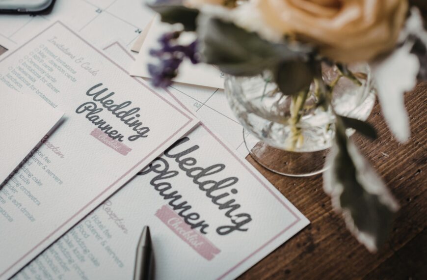 Wedding planner notebook and pen on a wooden table, used for planning Sri Lankan weddings and marriage proposals on Poruwa.lk.