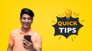 A smiling man in a peach polo shirt looking at his phone, alongside a “Quick Tips” light bulb graphic on a yellow background, representing helpful tips, mobile usage, and easy online guidance.