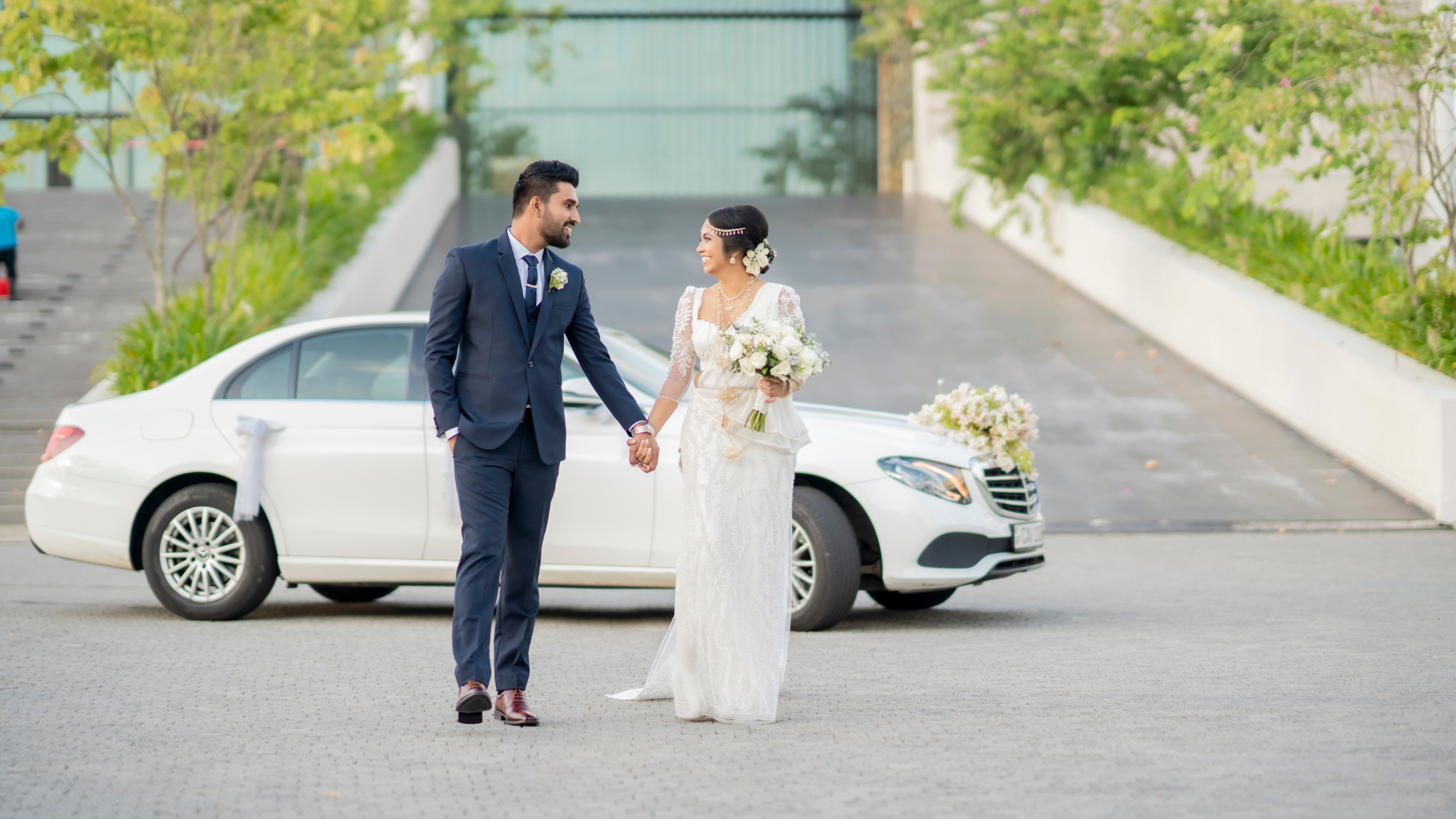A professional wedding photographer capturing a couple's special moment in Bangalore, showcasing love and celebration.