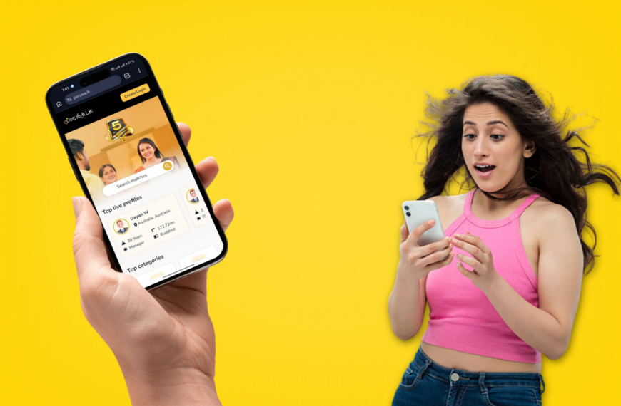 A woman holding a smartphone against a bright yellow background, smiling and looking at the device.