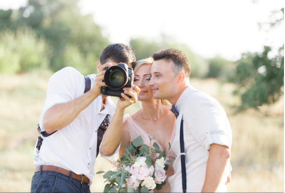 A professional photographer documenting a Sri Lankan wedding ceremony, preserving memories of marriage proposals Sri Lanka, buddhist matrimony, catholic marriage proposals, and poruwa ceremony celebrations within matrimony Sri Lanka.
