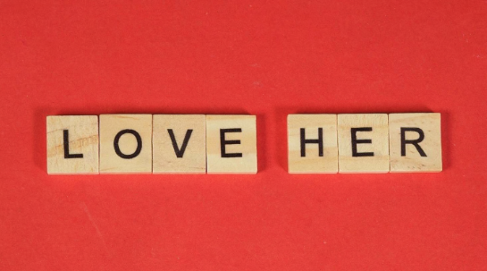 Scrabble letters arranged to spell “love her” on a wooden game board, symbolizing love, relationships, and emotional connection in Sri Lankan matrimony and srilanka matrimony contexts, marriage proposal Sri Lanka, marriage proposals in Sri Lanka, marriage proposals Sri Lanka, mangala yojana, wedding proposal website services, buddhist matrimony, catholic marriage proposals, and Lanka brides and grooms.