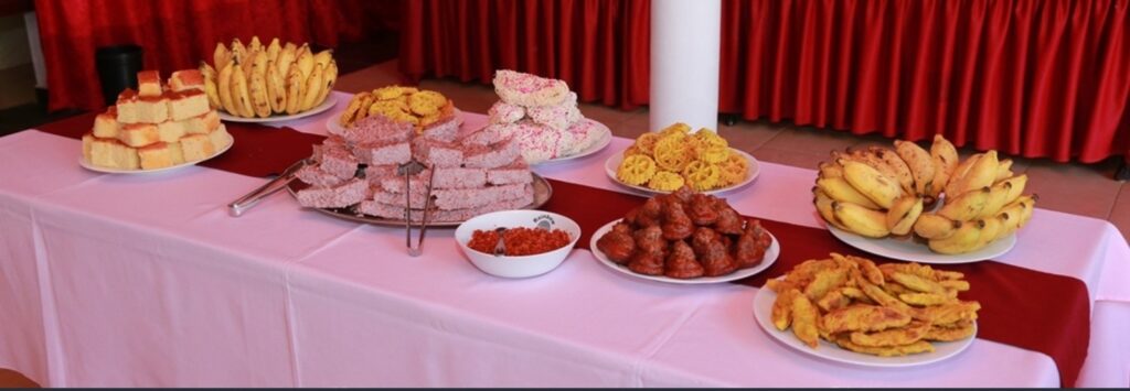 Traditional Sri Lankan wedding buffet table with pastries, bananas, and fried snacks arranged elegantly for a poruwa ceremony celebration, showcasing Sri Lankan wedding traditions and mangala yojana culture featured on Poruwa.lk | ශ්‍රී ලාංකීය මංගල යෝජනා, a trusted wedding proposal website for marriage proposal Sri Lanka, marriage proposals in Sri Lanka, matrimony Sri Lanka, Sri Lanka matrimony, Buddhist matrimony, Catholic marriage proposals, Lanka brides and grooms, LankaMatrimony, Purahanda LK, Hitad marriage proposals, and Liyathabara marriage proposals in Sri Lanka.