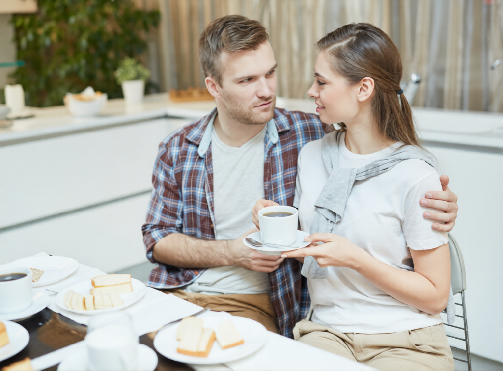 A Sri Lankan couple enjoying coffee and breakfast together at a table, sharing a conversation and a meaningful moment of love and companionship. Represents a happy relationship and emotional connection for couples exploring marriage proposals Sri Lanka, mangala yojana, and matrimony Sri Lanka through Poruwa.lk | ශ්‍රී ලාංකීය මංගල යෝජනා, a trusted wedding proposal website for lanka brides and grooms, srilanka matrimony, buddhist matrimony, catholic marriage proposals, and liyathabara marriage proposals in Sri Lanka.