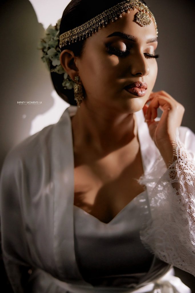 A beautiful bride wearing a white and gold wedding gown, smiling radiantly on her special day, representing Sri Lankan wedding traditions, mangala yojana, marriage proposals in Sri Lanka, matrimony Sri Lanka, srilanka matrimony, lanka brides and grooms, Buddhist matrimony, Catholic marriage proposals, liyathabara marriage proposals in Sri Lanka, and Poruwa.lk | ශ්‍රී ලාංකීය මංගල යෝජනා.