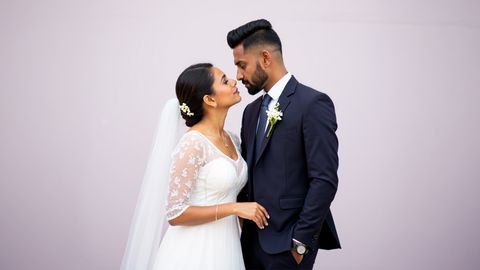 A joyful couple shares a beautiful wedding moment in Dubai, celebrating Sri Lankan marriage proposals and matrimony with elegant wedding photography by Poruwa.lk.
